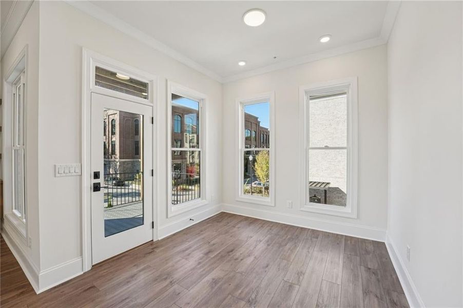 Sun room space continues with upgraded theme- crown molding and extra LED lights- this space you can also add a fan.  Image is of a previously built Chamberlain plan.