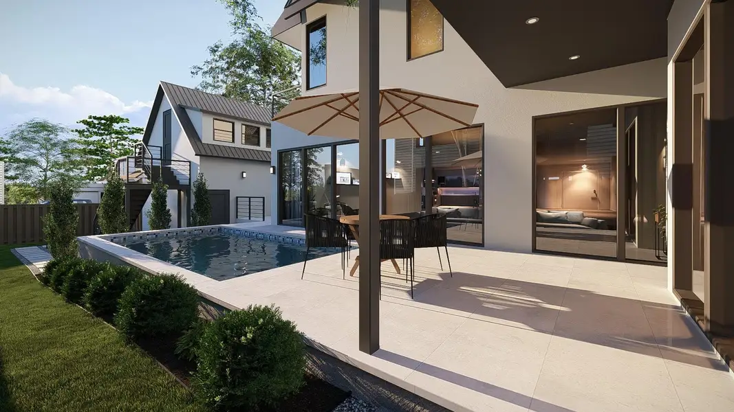 Rear view of house with a patio and stucco siding Rear view of house with a patio and stucco siding
