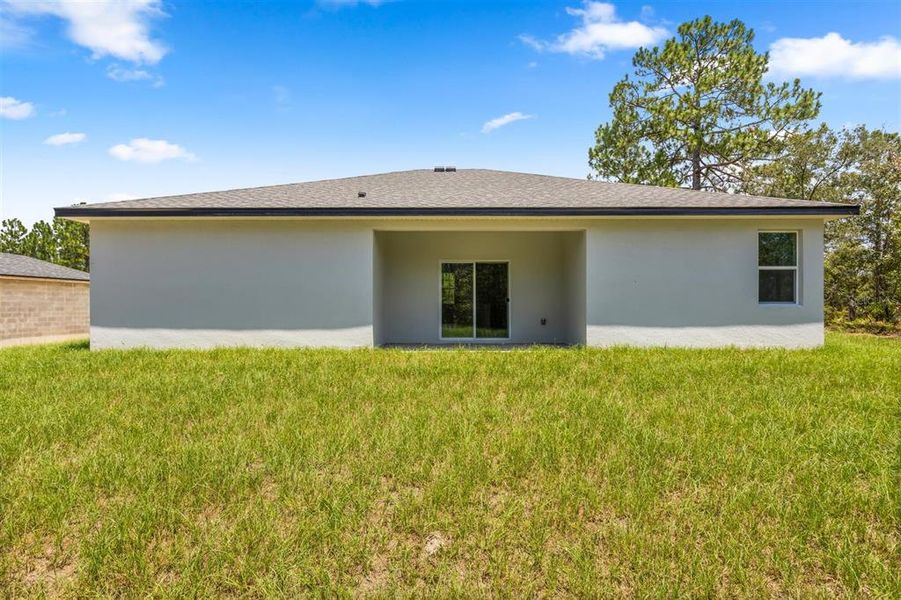 Front exterior of a new home in , Citrus Springs, FL, highlighting curb appeal (Image 15). Front exterior of a new home in , Citrus Springs, FL, highlighting curb appeal (Image 15).