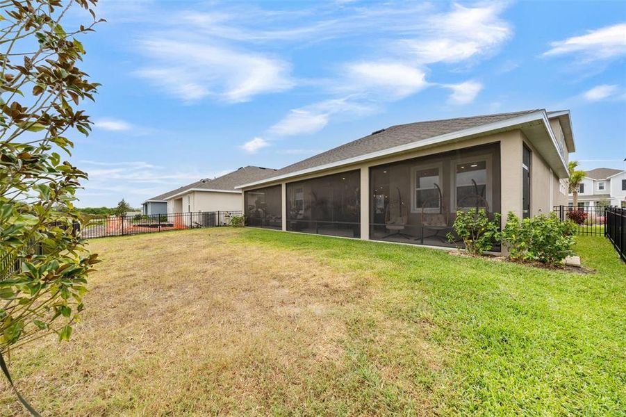 Exterior details and patio area of a home in Seaire, Parrish (Image 3).