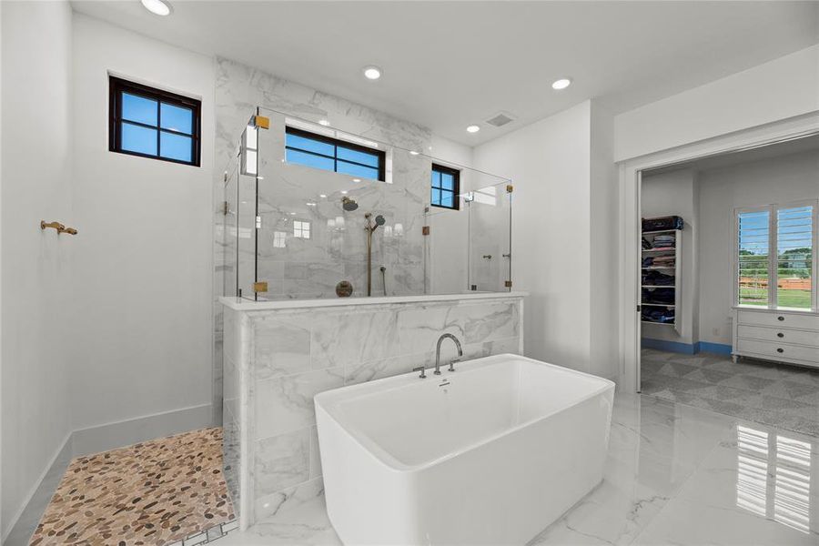 The soaking tub is a perfect space to sink in, unwind and relax.