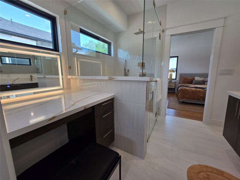 Ensuite bathroom with vanity, ensuite bath, and a shower stall Ensuite bathroom with vanity, ensuite bath, and a shower stall