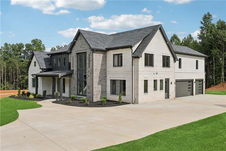 Front exterior of a new home in , Braselton, GA, highlighting curb appeal (Image 48).