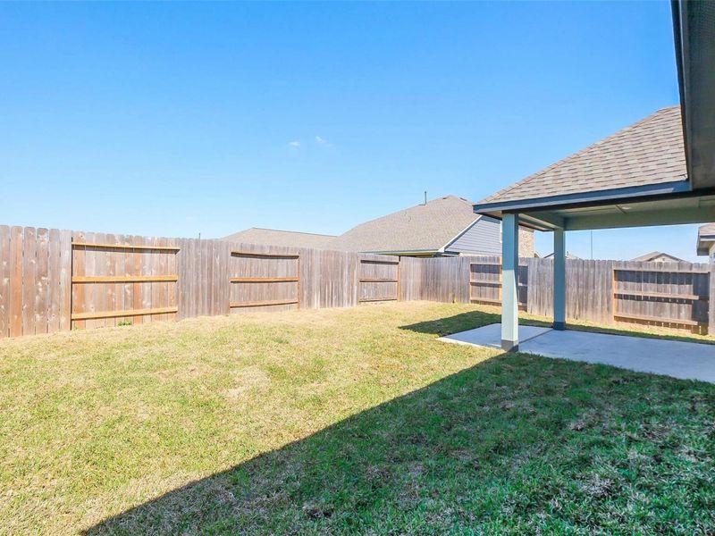 Exterior details and patio area of a home in Sunterra, Katy (Image 25).
