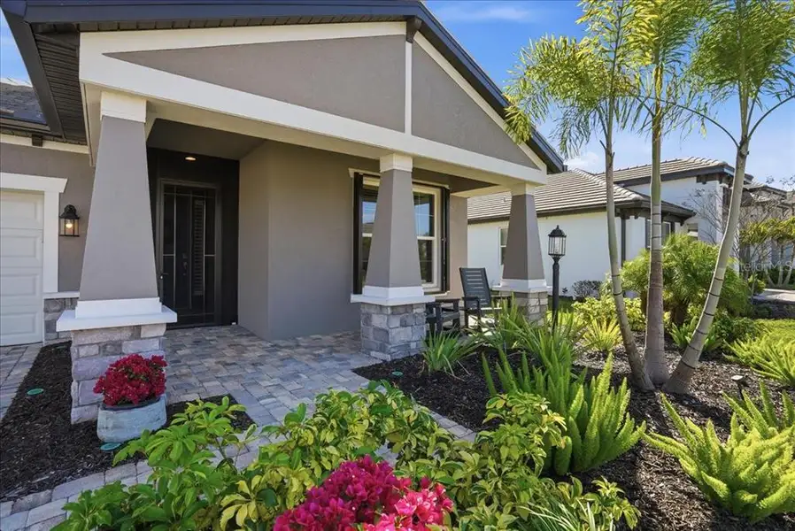 Exterior details and patio area of a home in Cypress Glen at River Wilderness, Parrish (Image 3).