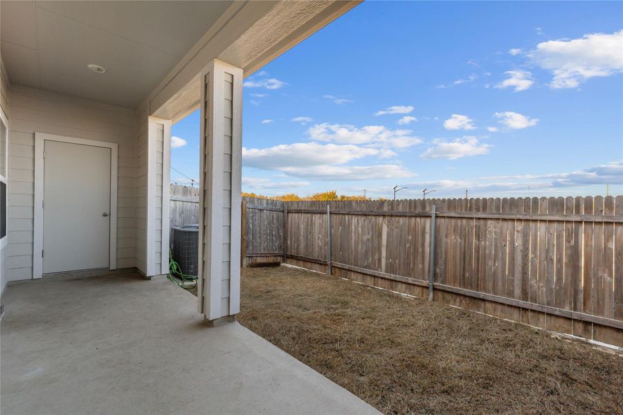 Fenced backyard with a patio Fenced backyard with a patio