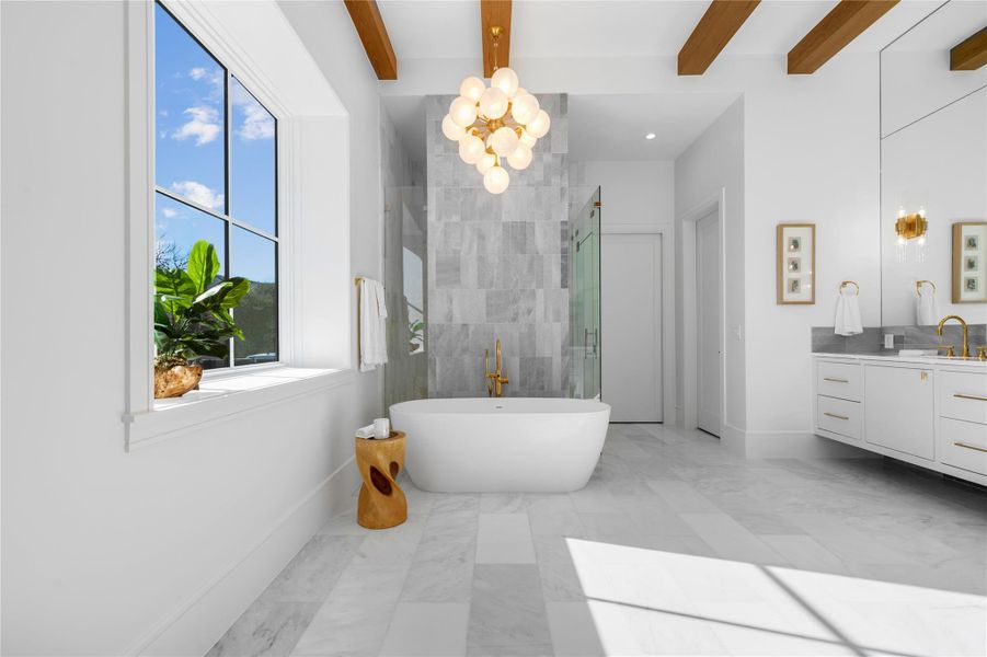 Bathroom with vanity, plenty of natural light, marble finish floors, beamed ceiling, and a chandelier Bathroom with vanity, plenty of natural light, marble finish floors, beamed ceiling, and a chandelier