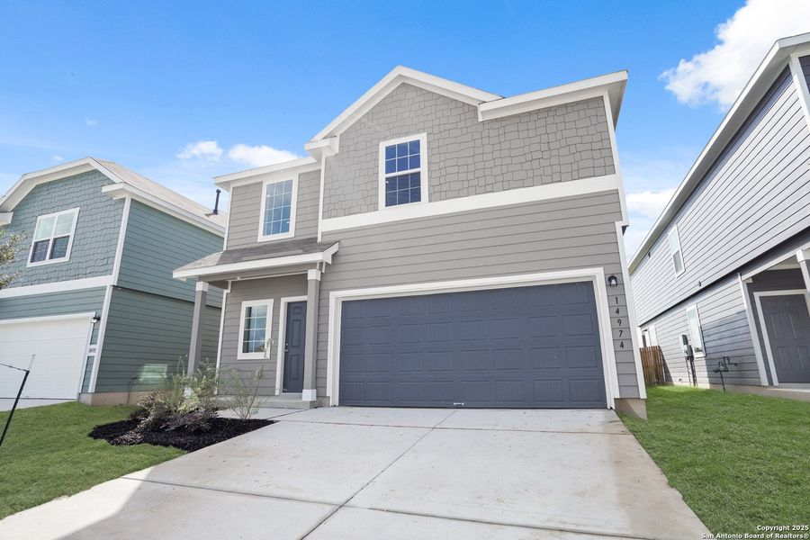 Front exterior of a new home in Timber Creek, San Antonio, TX, highlighting curb appeal (Image 23).