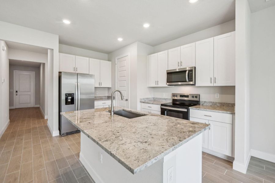 Furnished interior view inside a new home in Brystol at Wylder - Reserve Series, Port St. Lucie (Image 6).
