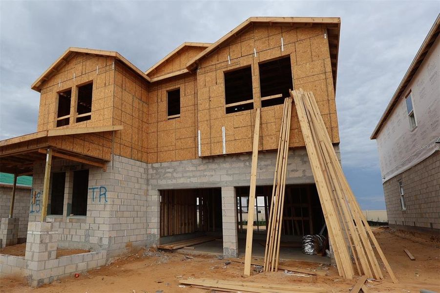In-progress construction of a new home in Lake Star at Ovation, Winter Garden, FL (Image 5).