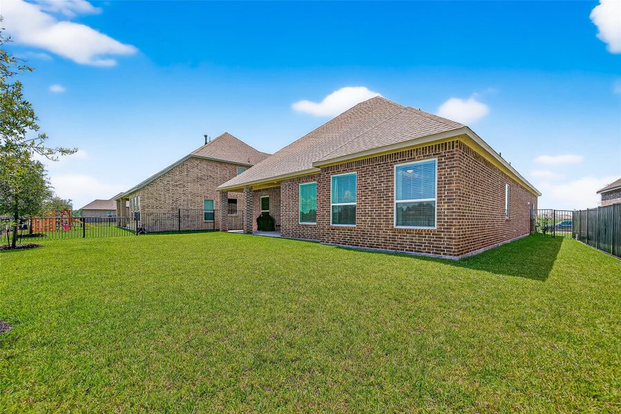 Front exterior of a new home in Sierra Vista, Iowa Colony, TX, highlighting curb appeal (Image 22). Front exterior of a new home in Sierra Vista, Iowa Colony, TX, highlighting curb appeal (Image 22).