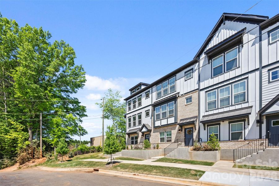 Front exterior of a new home in Parkside Commons, Davidson, NC, highlighting curb appeal (Image 23).