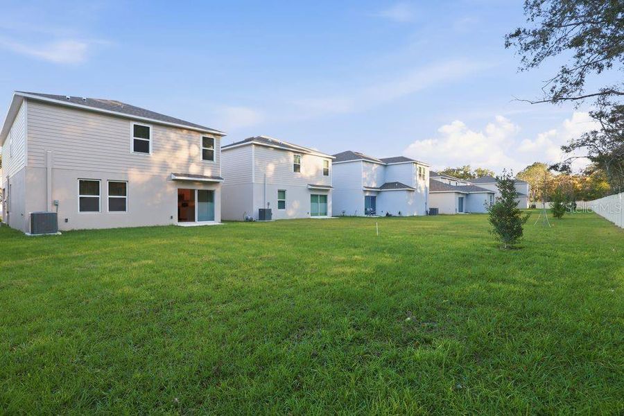 Exterior details and patio area of a home in Palm Wind, Hudson (Image 3).
