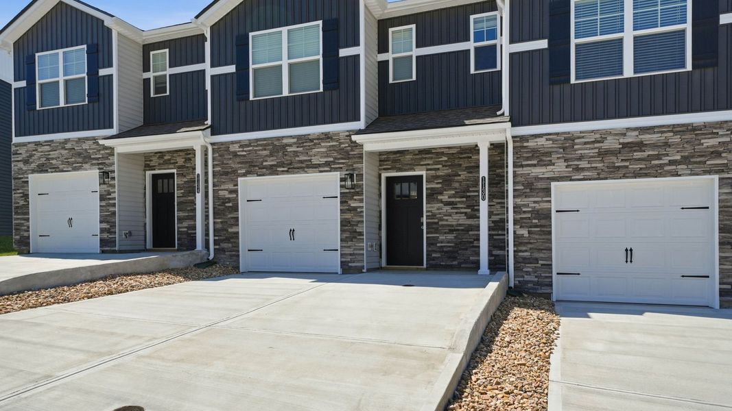 Front exterior of a new home in The Arbor Townhomes, Kingsport, TN, highlighting curb appeal (Image 1). Front exterior of a new home in The Arbor Townhomes, Kingsport, TN, highlighting curb appeal (Image 1).