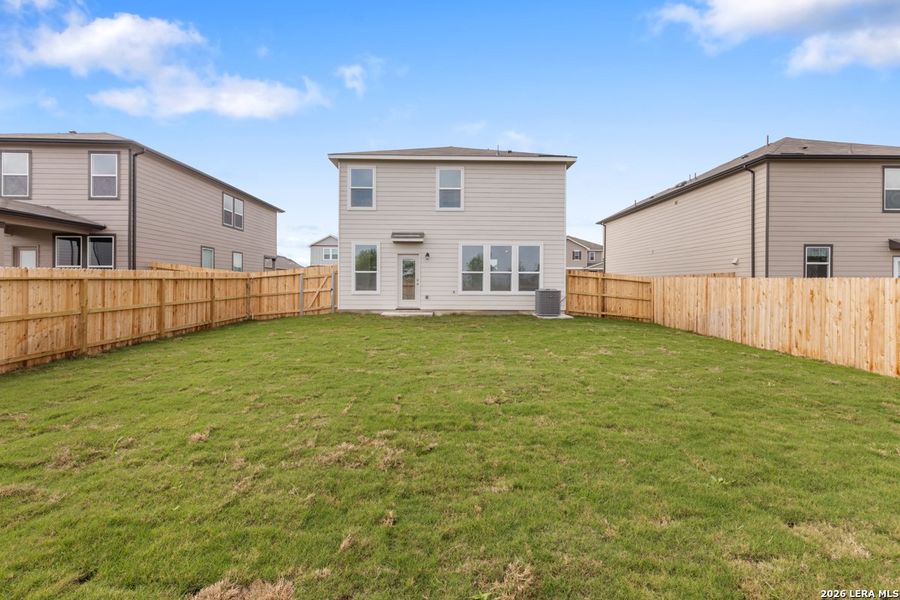 Exterior details and patio area of a home in Woodside Farms, Seguin (Image 4).