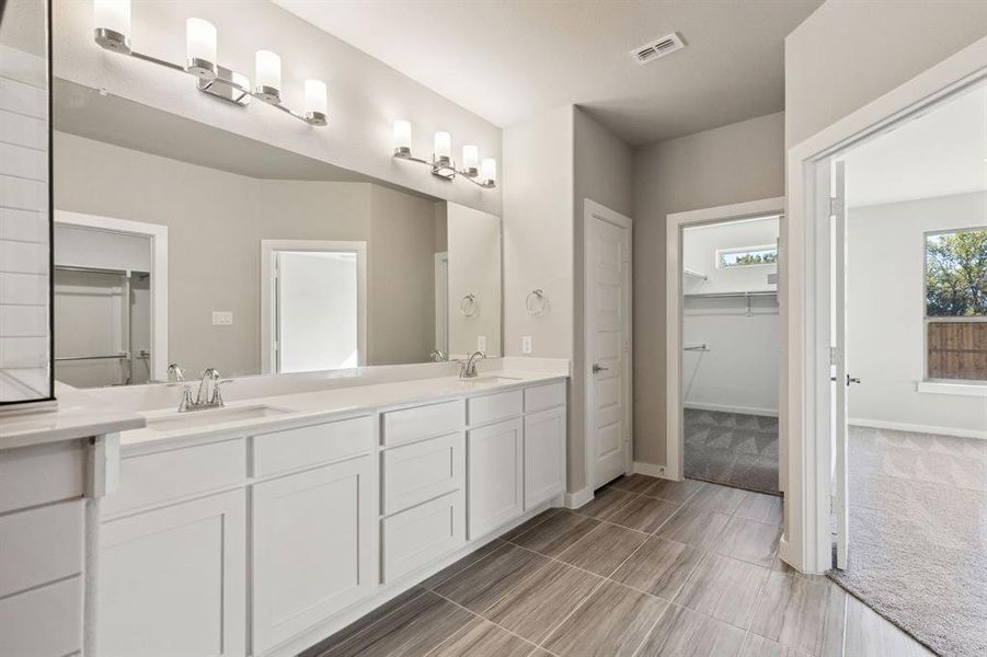 Primary Bathroom in the Morrison home plan by Trophy Signature Homes – REPRESENTATIVE PHOTO Primary Bathroom in the Morrison home plan by Trophy Signature Homes – REPRESENTATIVE PHOTO