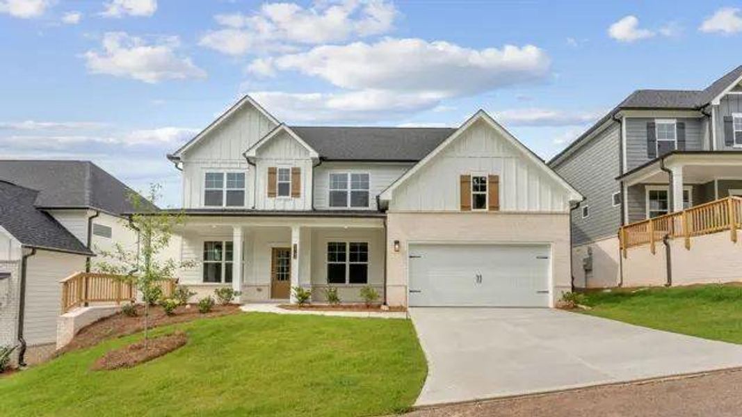 Front exterior of a new home in The Estates at Gainesville Township, Gainesville, GA, highlighting curb appeal (Image 1). Front exterior of a new home in The Estates at Gainesville Township, Gainesville, GA, highlighting curb appeal (Image 1).