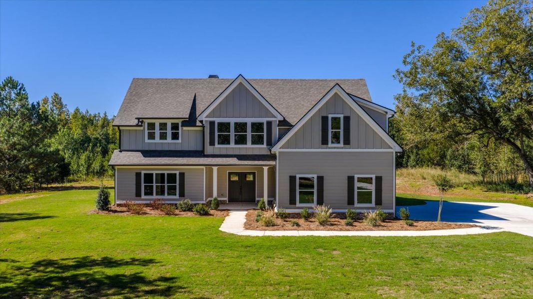 Front exterior of a new home in Collier Grove, Thomaston, GA, highlighting curb appeal (Image 1). Front exterior of a new home in Collier Grove, Thomaston, GA, highlighting curb appeal (Image 1).