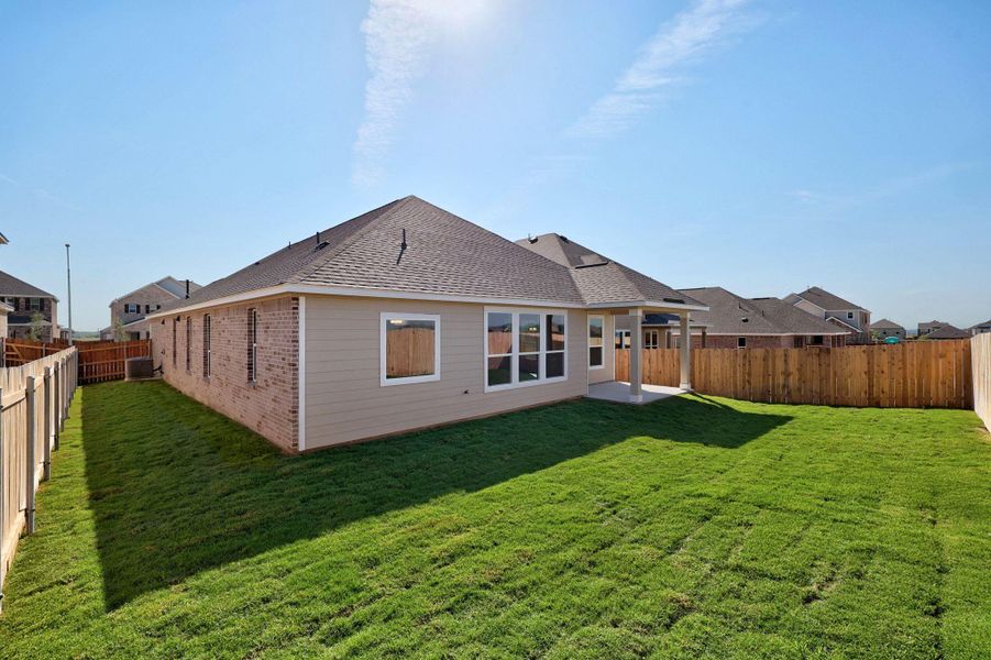 Front exterior of a new home in Salerno - Classic Collection, Round Rock, TX, highlighting curb appeal (Image 14). Front exterior of a new home in Salerno - Classic Collection, Round Rock, TX, highlighting curb appeal (Image 14).