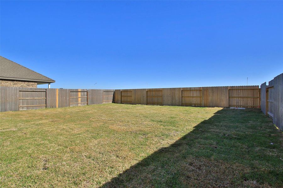 Exterior details and patio area of a home in Sunterra, Katy (Image 23).