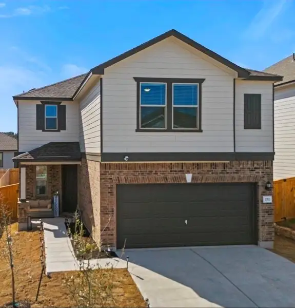 Front exterior of a new home in Sonterra - Cool Water, Jarrell, TX, highlighting curb appeal (Image 1). Front exterior of a new home in Sonterra - Cool Water, Jarrell, TX, highlighting curb appeal (Image 1).