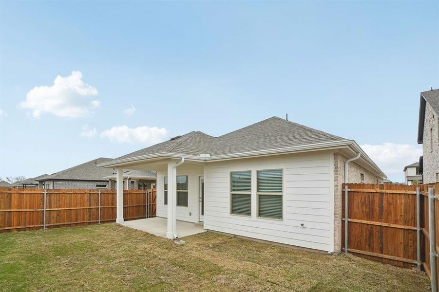 Exterior details and patio area of a home in Parks at Foster Crossing - Spring Series, Anna (Image 24).