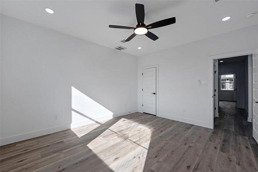 The secondary bedroom on the second floor has a closet with built-ins. No carpet throughout.