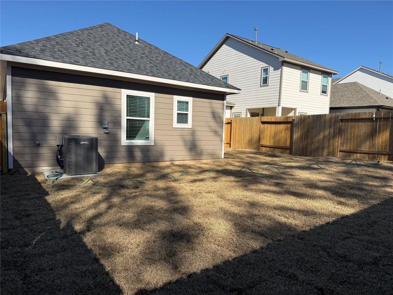 Exterior details and patio area of a home in East Gate Villas, Willis (Image 3).