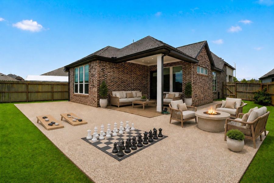 Extended concrete patio creates the perfect outdoor entertaining space. *Photo is virtually staged* Extended concrete patio creates the perfect outdoor entertaining space. *Photo is virtually staged*
