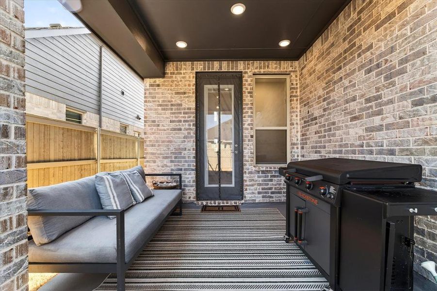 Exterior details and patio area of a home in Pecan Square, Northlake (Image 3).