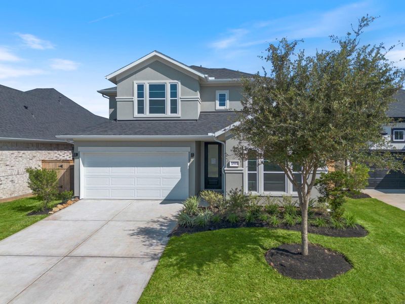 Front exterior of a new home in Sienna 45', 50', Missouri City, TX, highlighting curb appeal (Image 1). Front exterior of a new home in Sienna 45', 50', Missouri City, TX, highlighting curb appeal (Image 1).