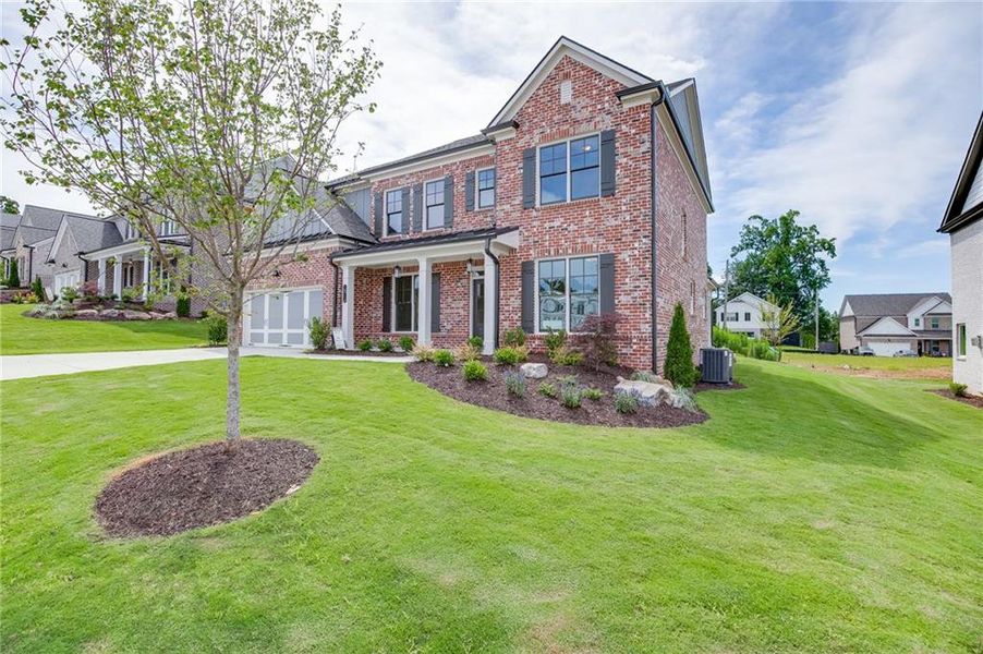 Front exterior of a new home in , Buford, GA, highlighting curb appeal (Image 24).