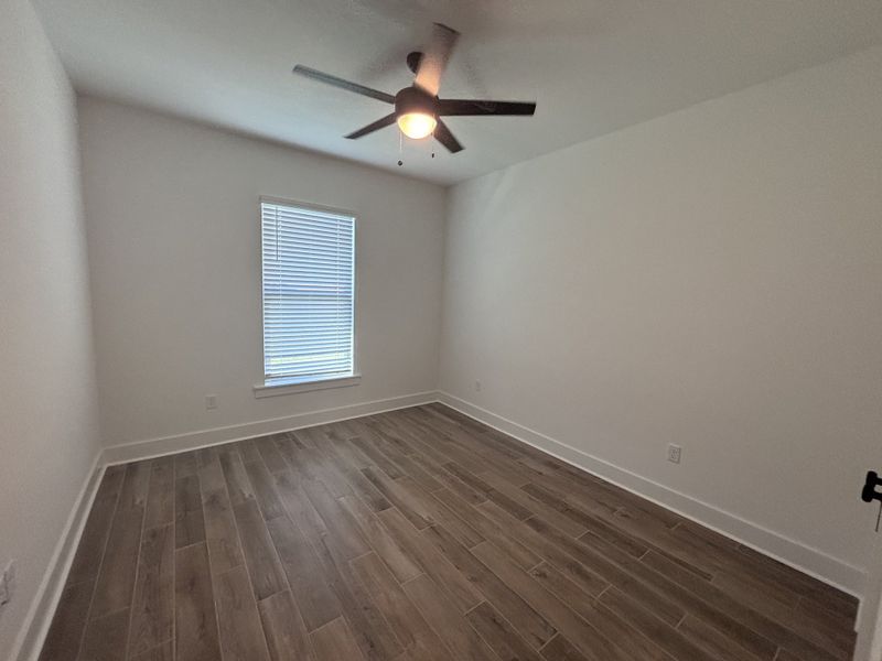 Spacious, unfurnished interior of a new home in Bird Song at Hammock Bay, Freeport (Image 26).