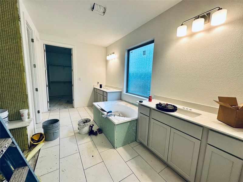 Primary Bath retreat with dual vanities, garden tub & walk-in shower Primary Bath retreat with dual vanities, garden tub & walk-in shower