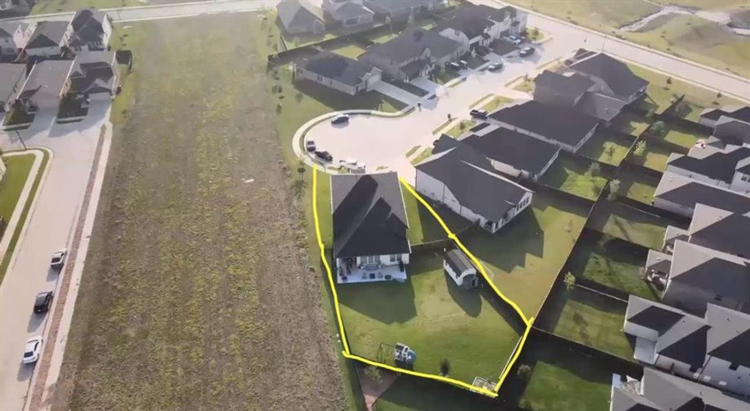 Aerial perspective of suburban area with property boundaries highlighted