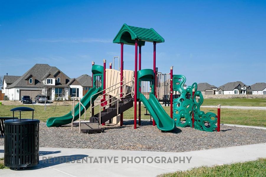 Communal playground with a residential view and a lawn Communal playground with a residential view and a lawn