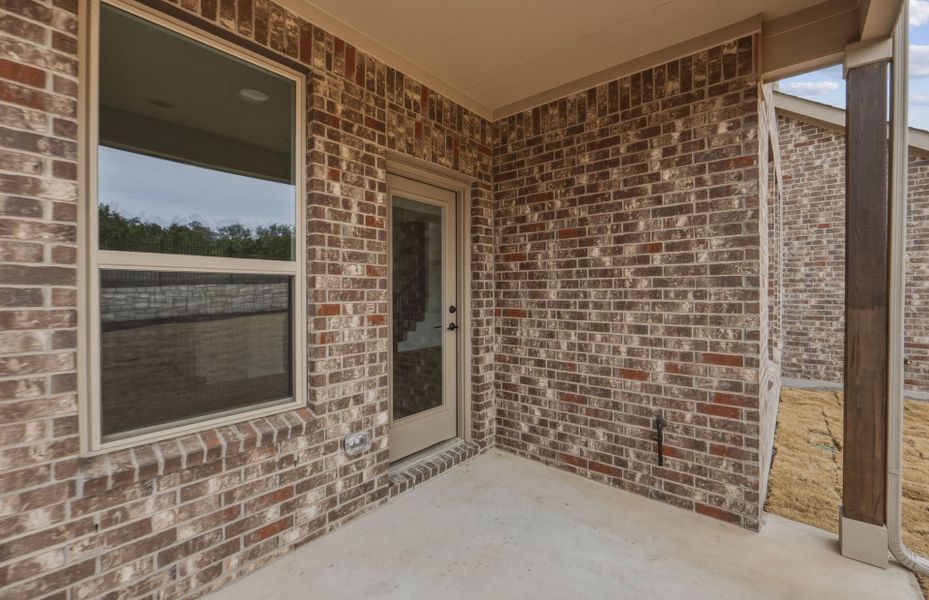 Exterior details and patio area of a home in West Cypress Hills, Spicewood (Image 27).
