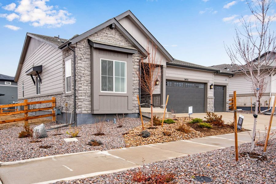 Front exterior of a new home in The Aurora Highlands, Aurora, CO, highlighting curb appeal (Image 2). Front exterior of a new home in The Aurora Highlands, Aurora, CO, highlighting curb appeal (Image 2).