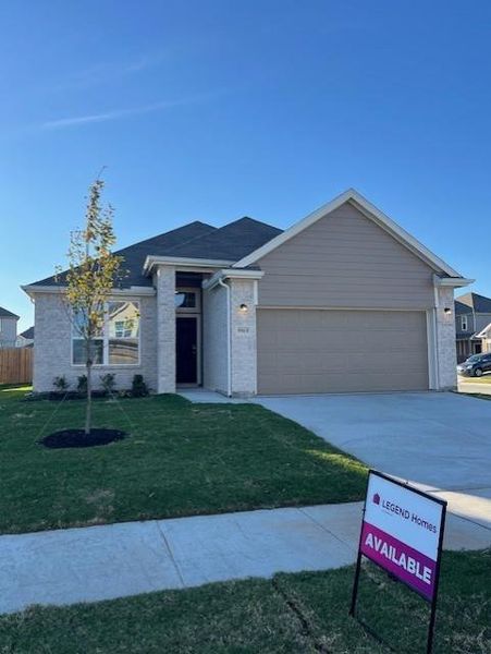 Front exterior of a new home in Retreat at Fossil Creek, Fort Worth, TX, highlighting curb appeal (Image 1).