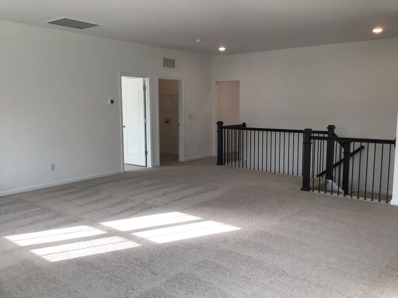 Loft featuring the AW Collection® Coastal - Flexible open space filled with natural light.