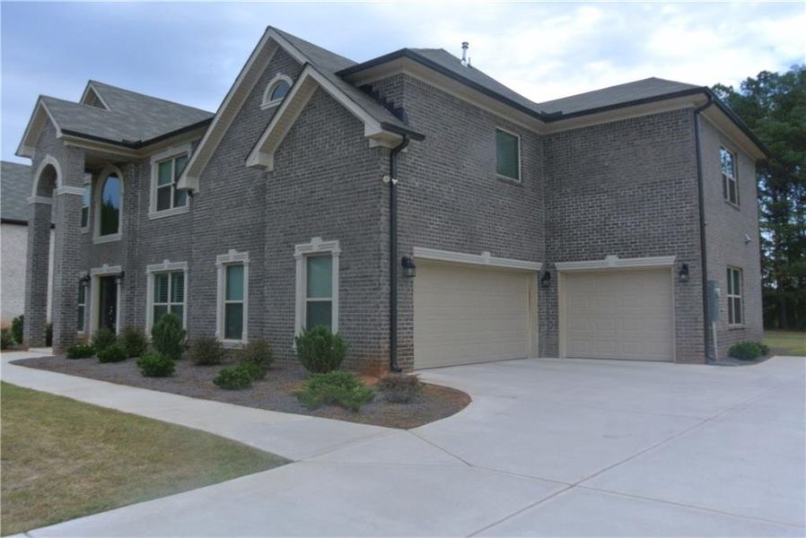 Front exterior of a new home in , Covington, GA, highlighting curb appeal (Image 2). Front exterior of a new home in , Covington, GA, highlighting curb appeal (Image 2).