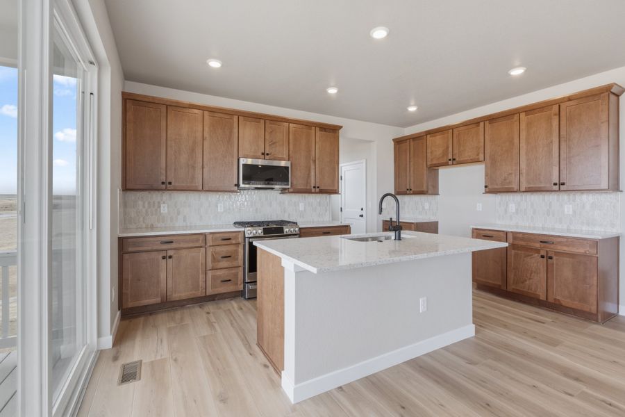 Furnished interior view inside a new home in The Aurora Highlands, Aurora (Image 6).