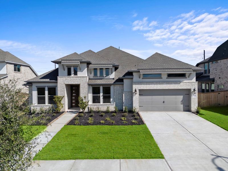 Front exterior of a new home in Valencia 70', Manvel, TX, highlighting curb appeal (Image 24).