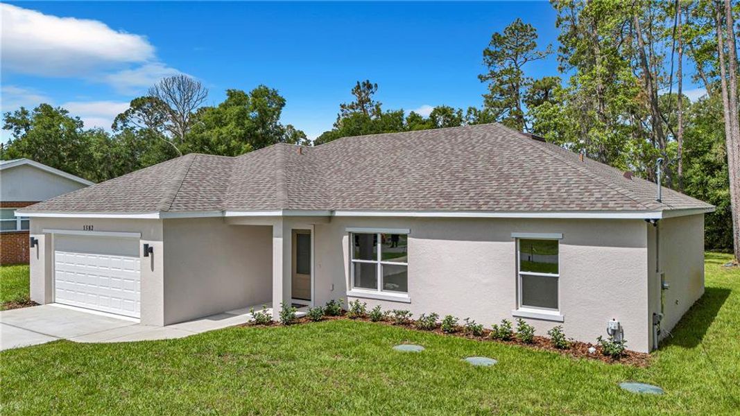 Front exterior of a new home in , Deland, FL, highlighting curb appeal (Image 22).