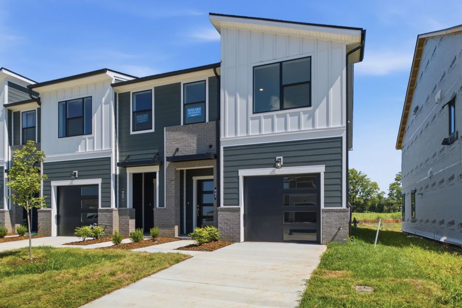 Front exterior of a new home in Nexus Townhomes, Gallatin, TN, highlighting curb appeal (Image 1). Front exterior of a new home in Nexus Townhomes, Gallatin, TN, highlighting curb appeal (Image 1).