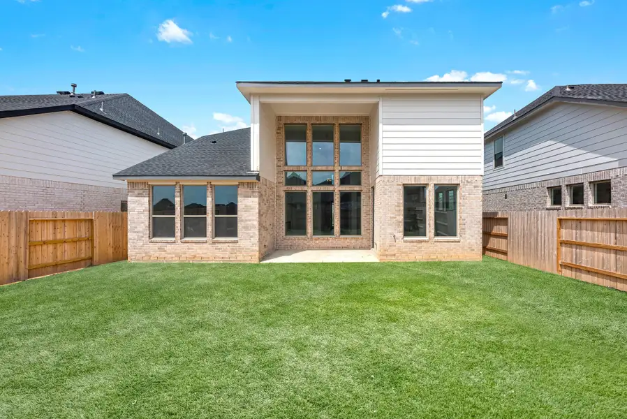 Exterior details and patio area of a home in Sunterra, Katy (Image 3).