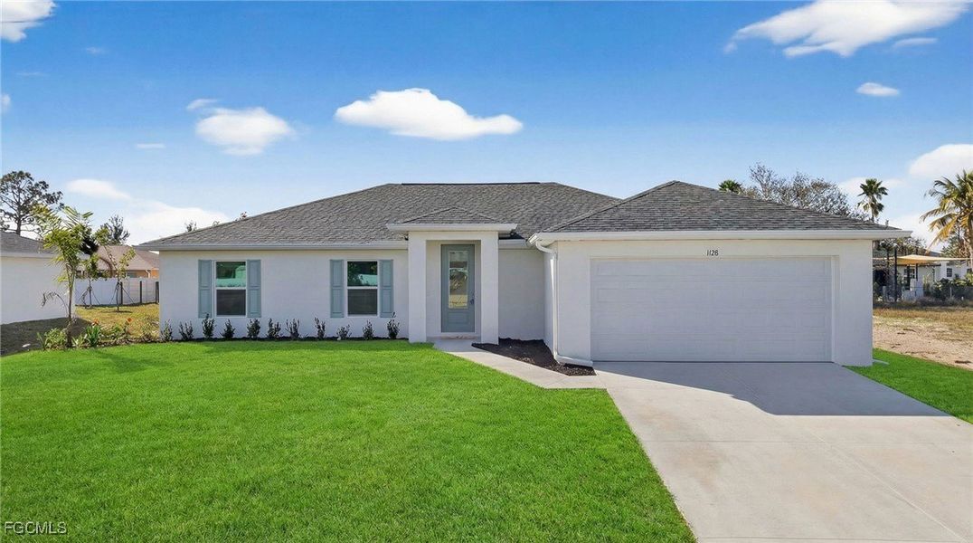 Front exterior of a new home in Cape Coral, Cape Coral, FL, highlighting curb appeal (Image 1). Front exterior of a new home in Cape Coral, Cape Coral, FL, highlighting curb appeal (Image 1).