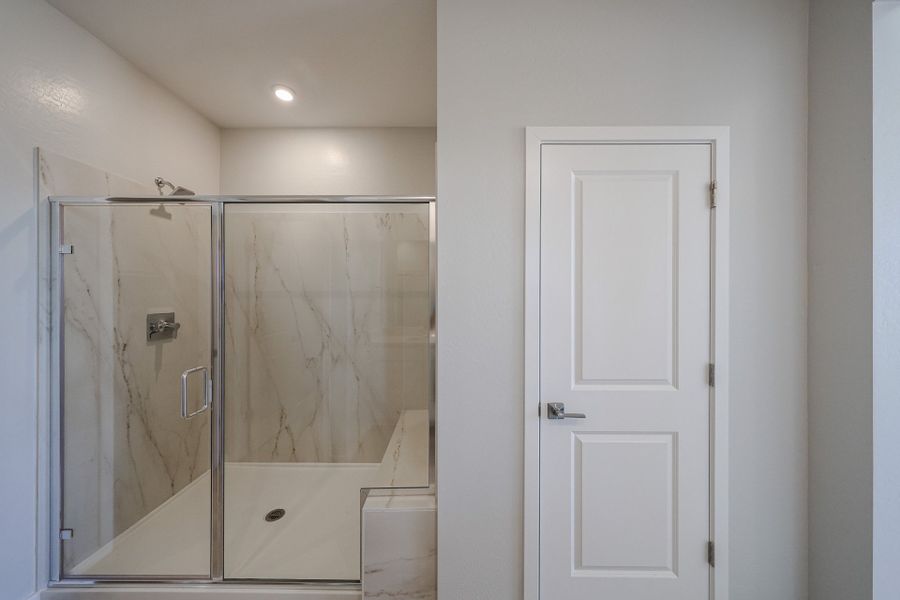 A bathroom with a glass shower.
