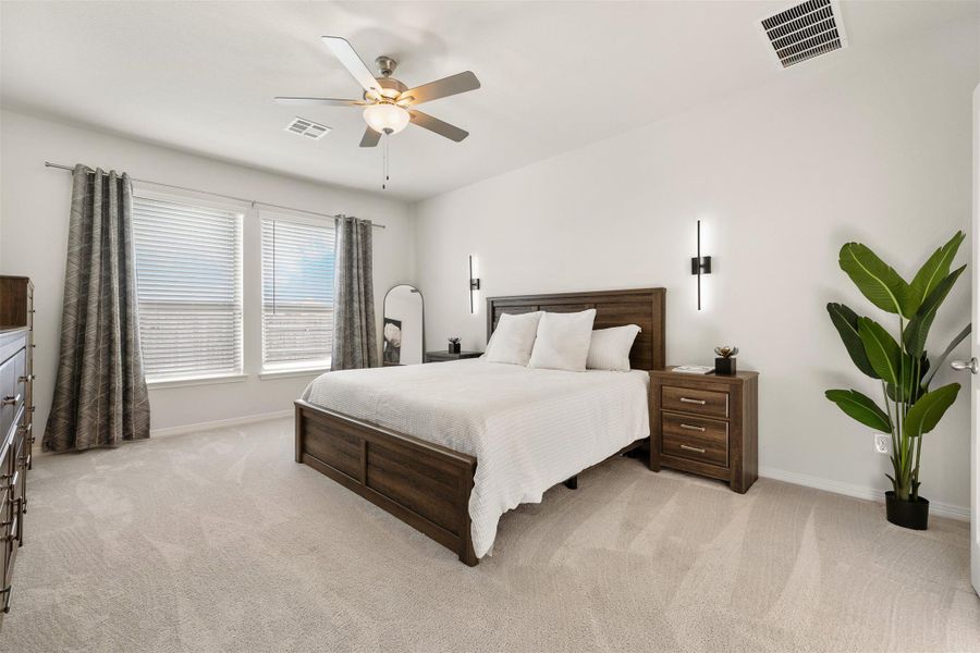 The primary bedroom sits quietly at the back of the home and brings in soft natural light throughout the day