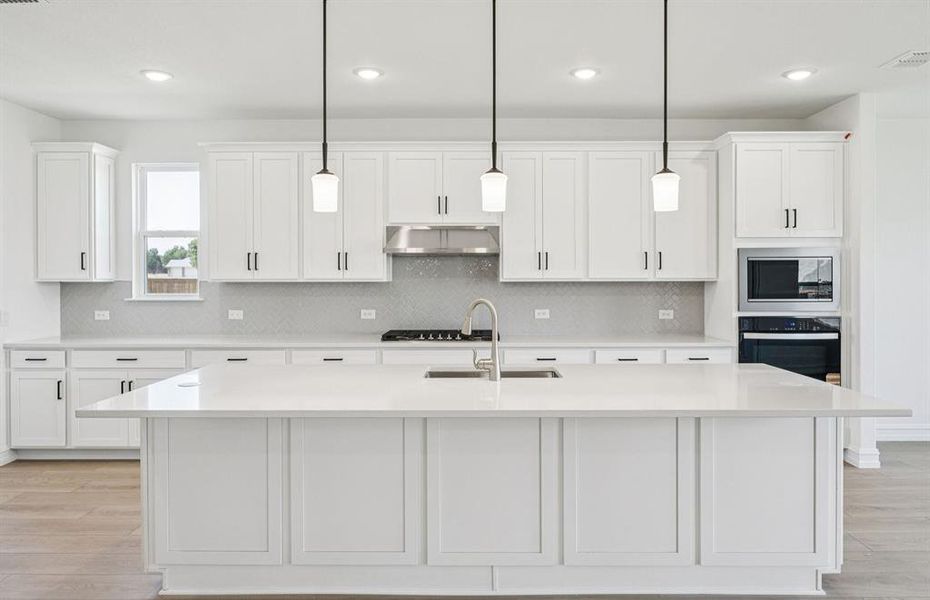 Spacious kitchen with eat-in bartop island Spacious kitchen with eat-in bartop island
